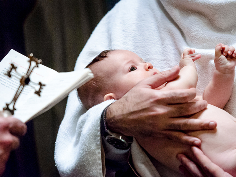 Important Steps To Planning A Christening Celebration Planning A Christening - Baby Held By Priest