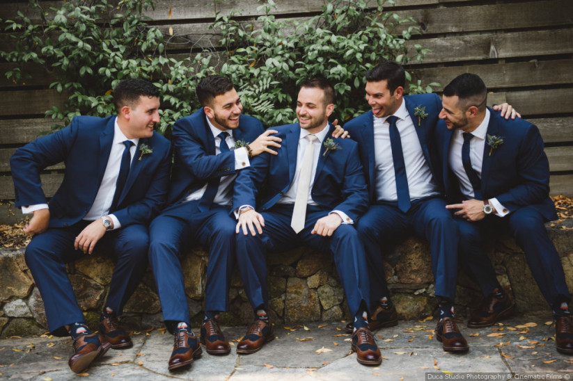 Groomsmen Sitting Together. Wedding Day Tips For The Groom.