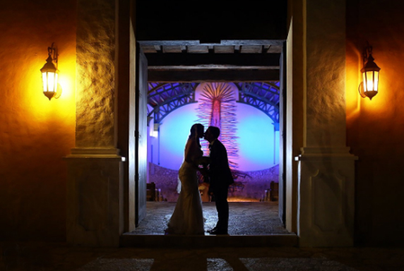 Wedding Reception Entrance - Silhouetted Couple Kissing